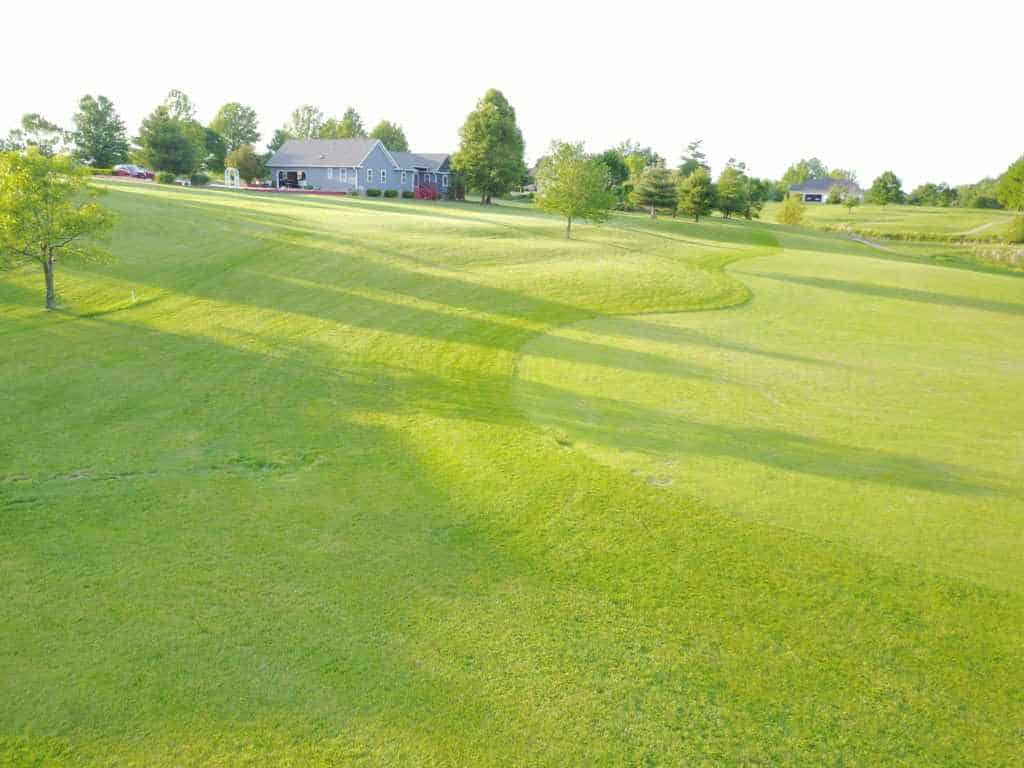 Green fairway leading to a beautiful home at Keller' Crossing at Stone Creek